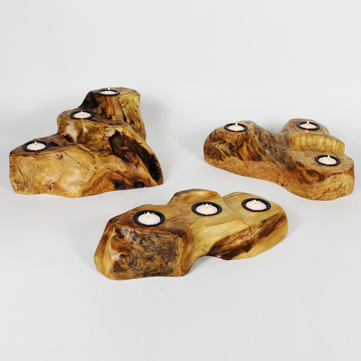 FUNCTIONAL ART is the best way to describe Greener Valley's stunning collection of stumps and roots that have been handcrafted into beautiful wine holders, cheese boards, platters, bowls and stools. Handcrafted from the roots and stumps of the Asian Cypress known as Shan Mu. These beautiful stools function equally well as a stool, end table or plant stand. Each piece is absolutely unique. This stool measures 24" high.