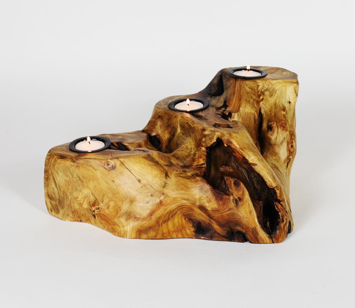 FUNCTIONAL ART is the best way to describe Greener Valley's stunning collection of stumps and roots that have been handcrafted into beautiful wine holders, cheese boards, platters, bowls and stools. Handcrafted from the roots and stumps of the Asian Cypress known as Shan Mu. These beautiful stools function equally well as a stool, end table or plant stand. Each piece is absolutely unique. This stool measures 24" high.