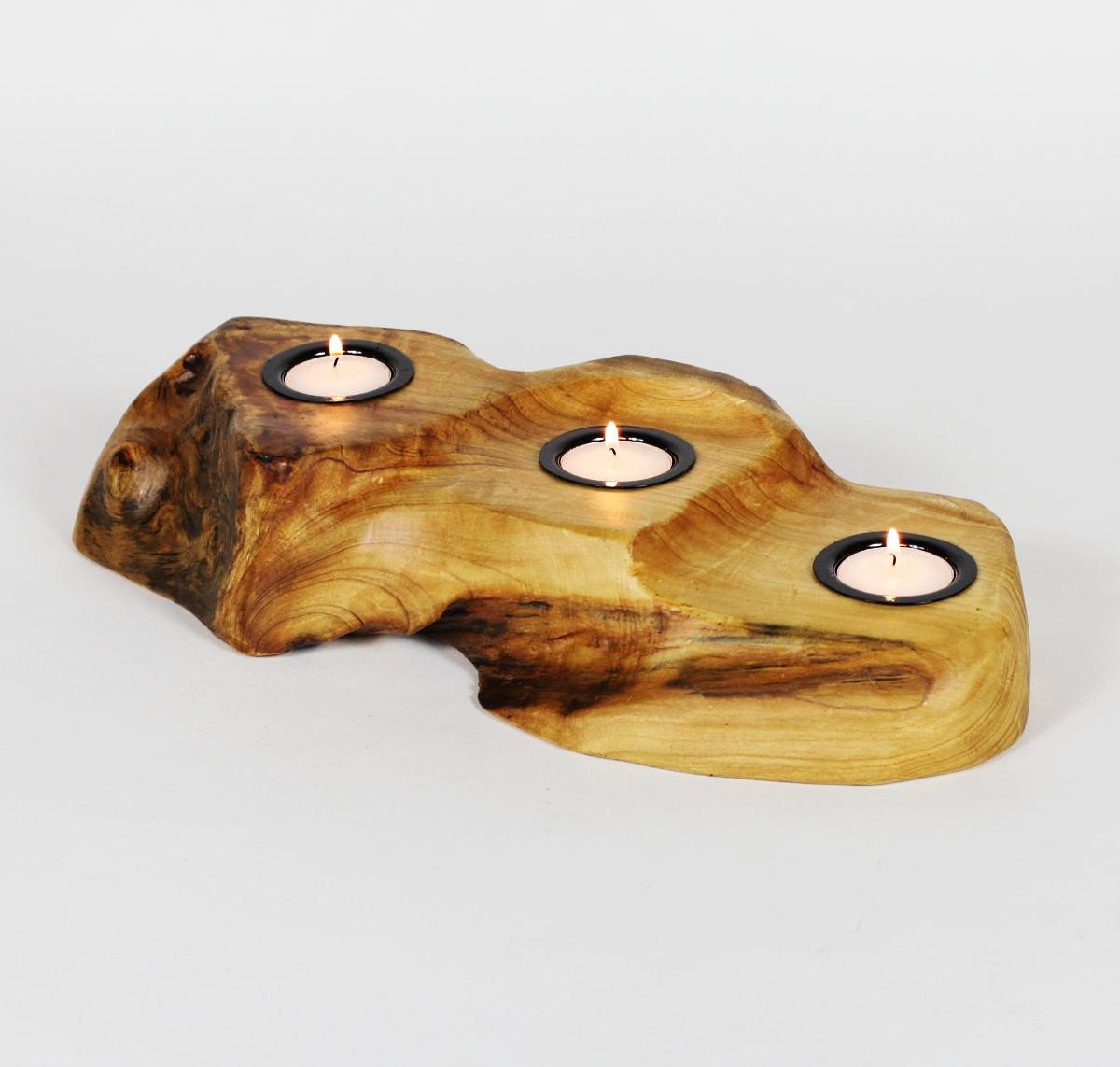 FUNCTIONAL ART is the best way to describe Greener Valley's stunning collection of stumps and roots that have been handcrafted into beautiful wine holders, cheese boards, platters, bowls and stools. Handcrafted from the roots and stumps of the Asian Cypress known as Shan Mu. These beautiful stools function equally well as a stool, end table or plant stand. Each piece is absolutely unique. This stool measures 24" high.