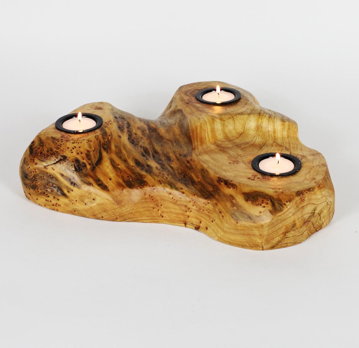 FUNCTIONAL ART is the best way to describe Greener Valley's stunning collection of stumps and roots that have been handcrafted into beautiful wine holders, cheese boards, platters, bowls and stools. Handcrafted from the roots and stumps of the Asian Cypress known as Shan Mu. These beautiful stools function equally well as a stool, end table or plant stand. Each piece is absolutely unique. This stool measures 24" high.