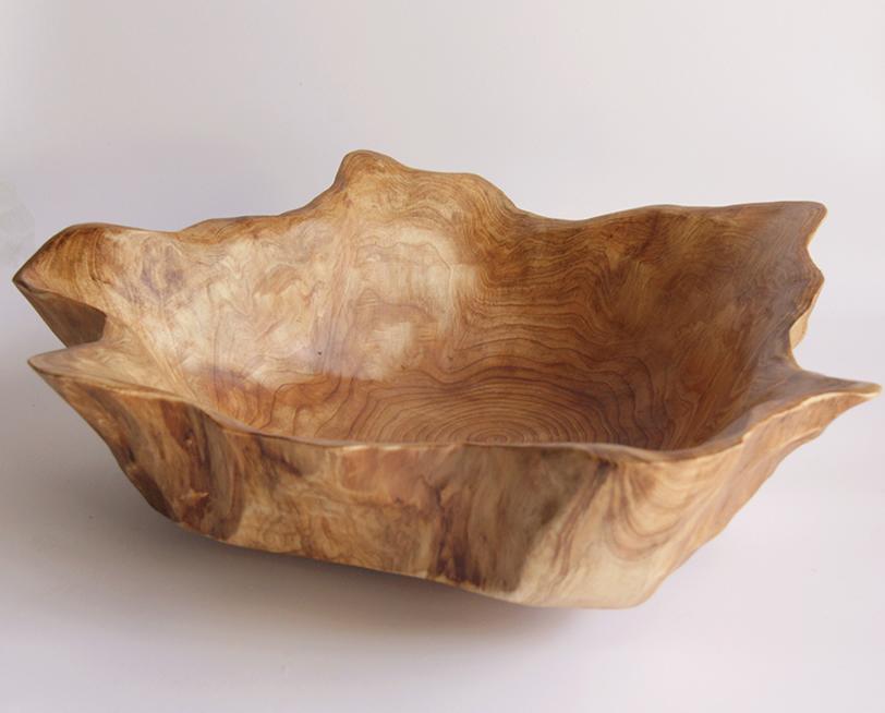 FUNCTIONAL ART is the best way to describe Greener Valley's stunning collection of stumps and roots that have been handcrafted into beautiful wine holders, cheese boards, platters, bowls and stools. Handcrafted from the roots and stumps of the Asian Cypress known as Shan Mu. These beautiful stools function equally well as a stool, end table or plant stand. Each piece is absolutely unique. This stool measures 24" high.